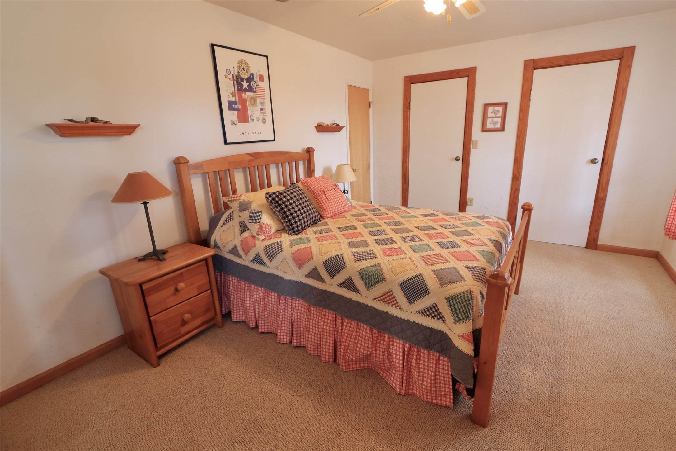 10173 Deer Ridge Road Bedias, TX 77831 - Photo 36 of 46 a bedroom with a bed and wooden floor