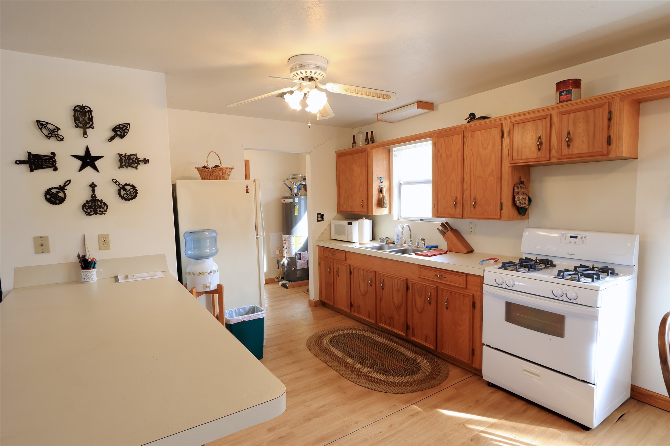 10173 Deer Ridge Road Bedias, TX 77831 - Photo 37 of 46 a kitchen with stainless steel appliances a stove a sink and a refrigerator