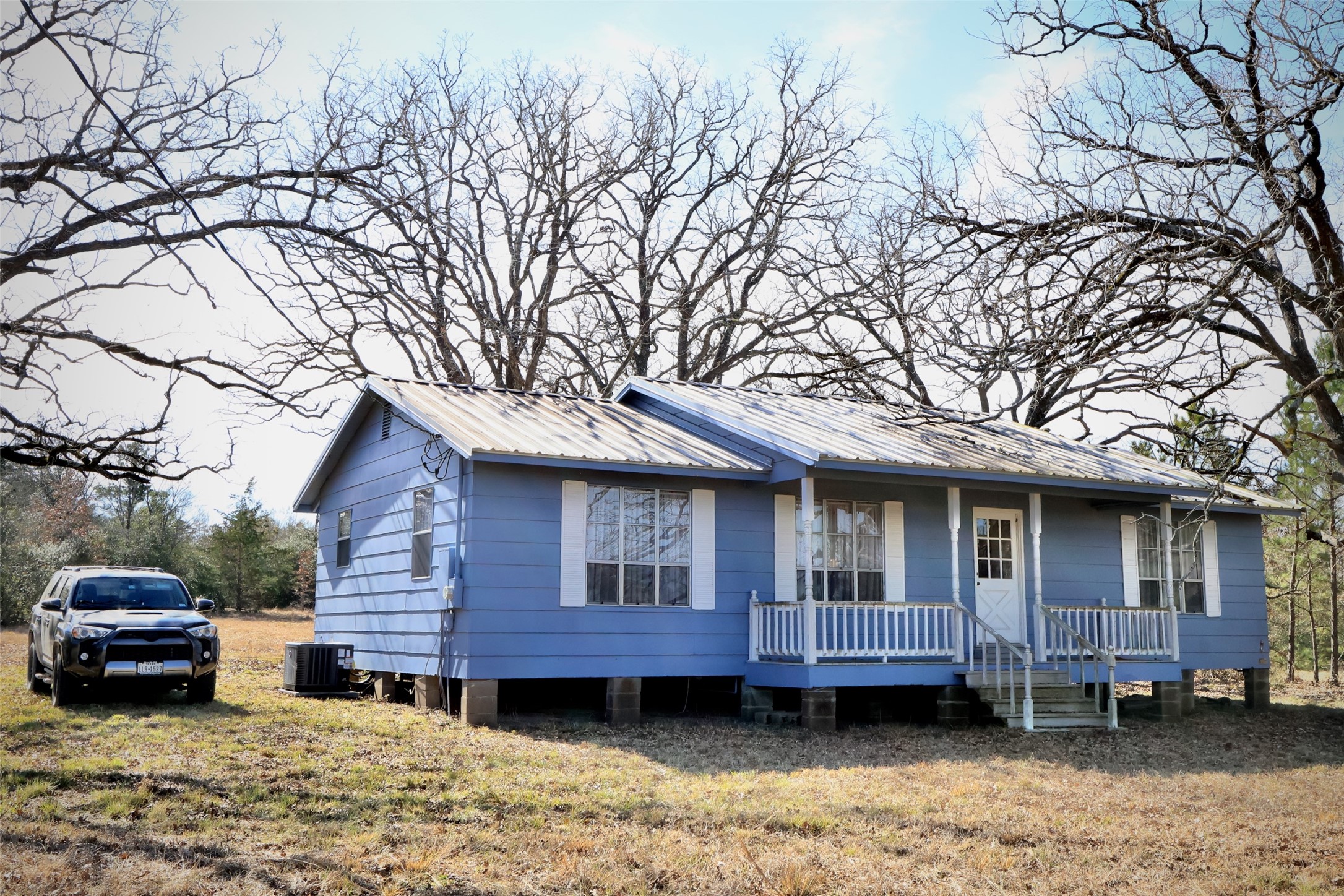 10173 Deer Ridge Road Bedias, TX 77831 - Photo 4 of 46 a view of a house with a yard