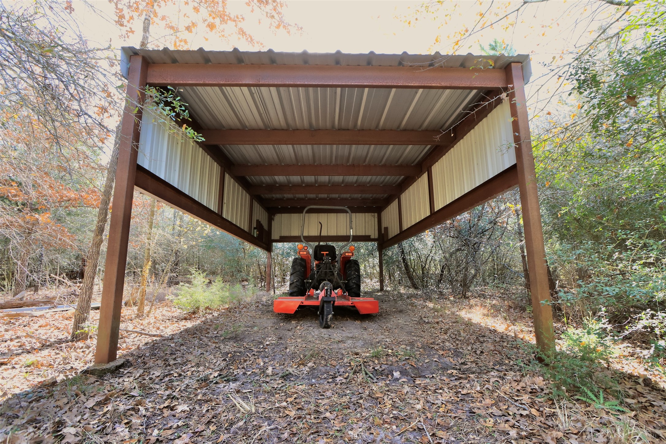 10173 Deer Ridge Road Bedias, TX 77831 - Photo 43 of 46 a view of roof deck with table and chairs and potted plants