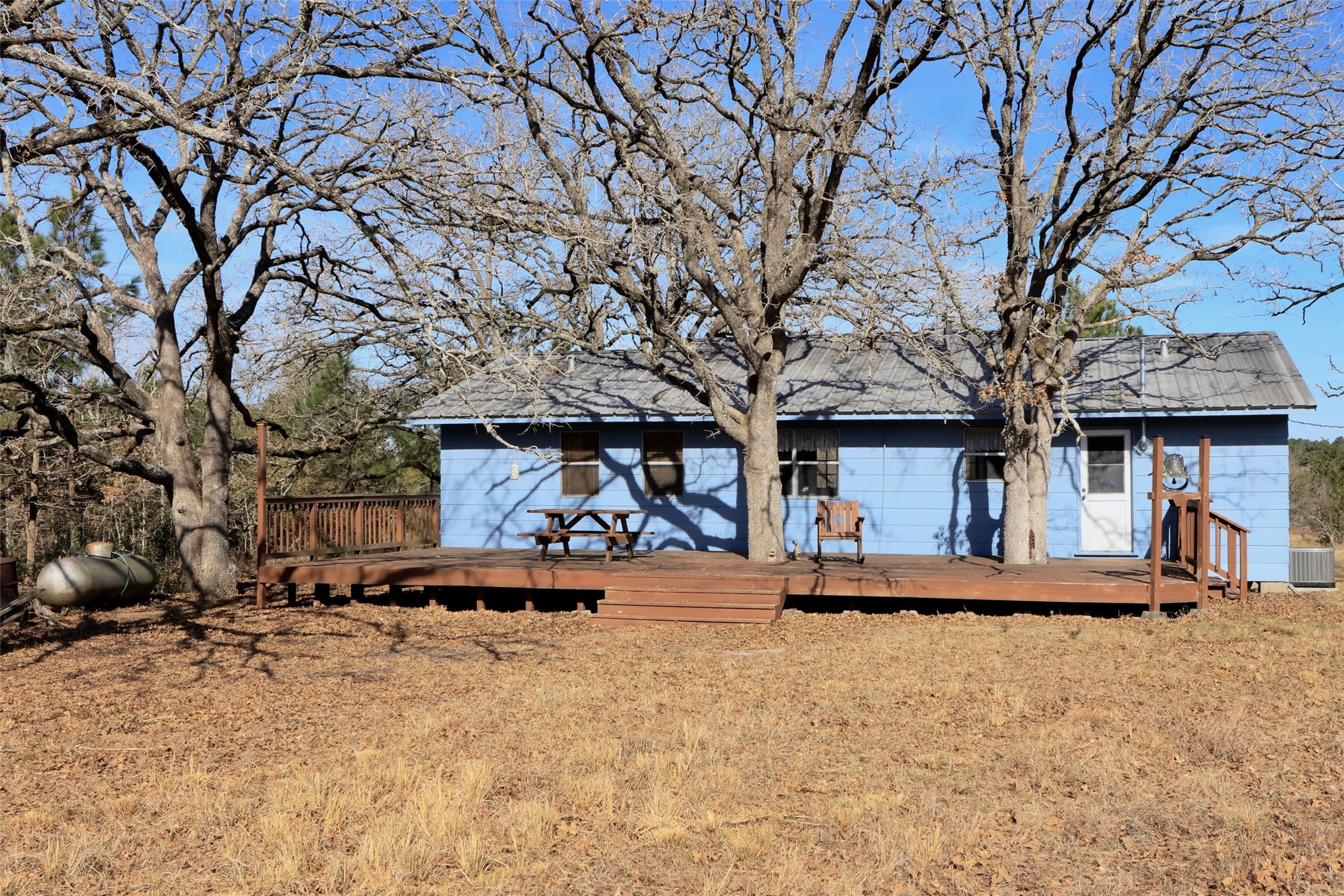 10173 Deer Ridge Road Bedias, TX 77831 - Photo 5 of 46 a view of a house with a yard covered in snow