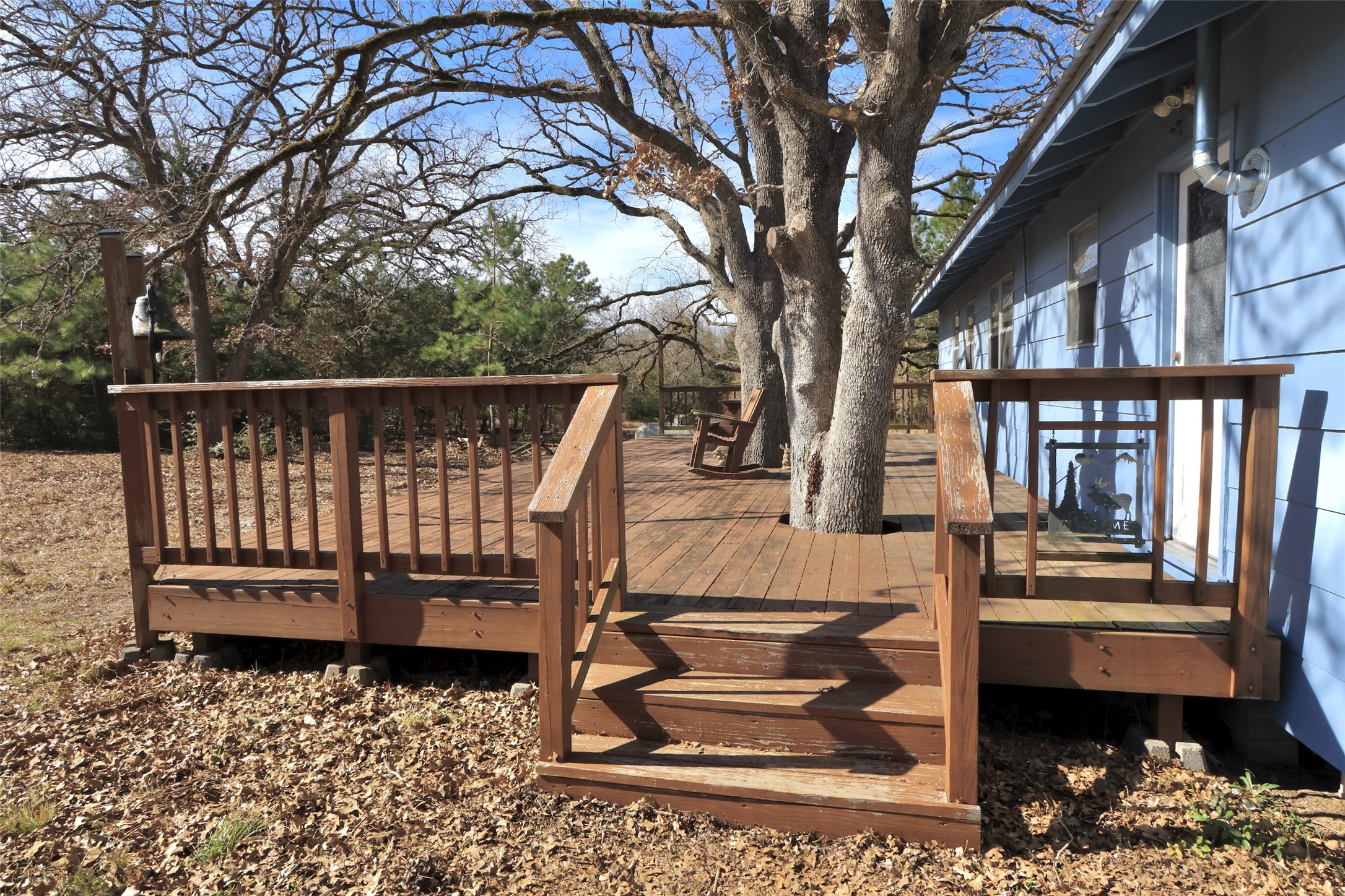 10173 Deer Ridge Road Bedias, TX 77831 - Photo 8 of 46 a view of a wooden deck with a bench