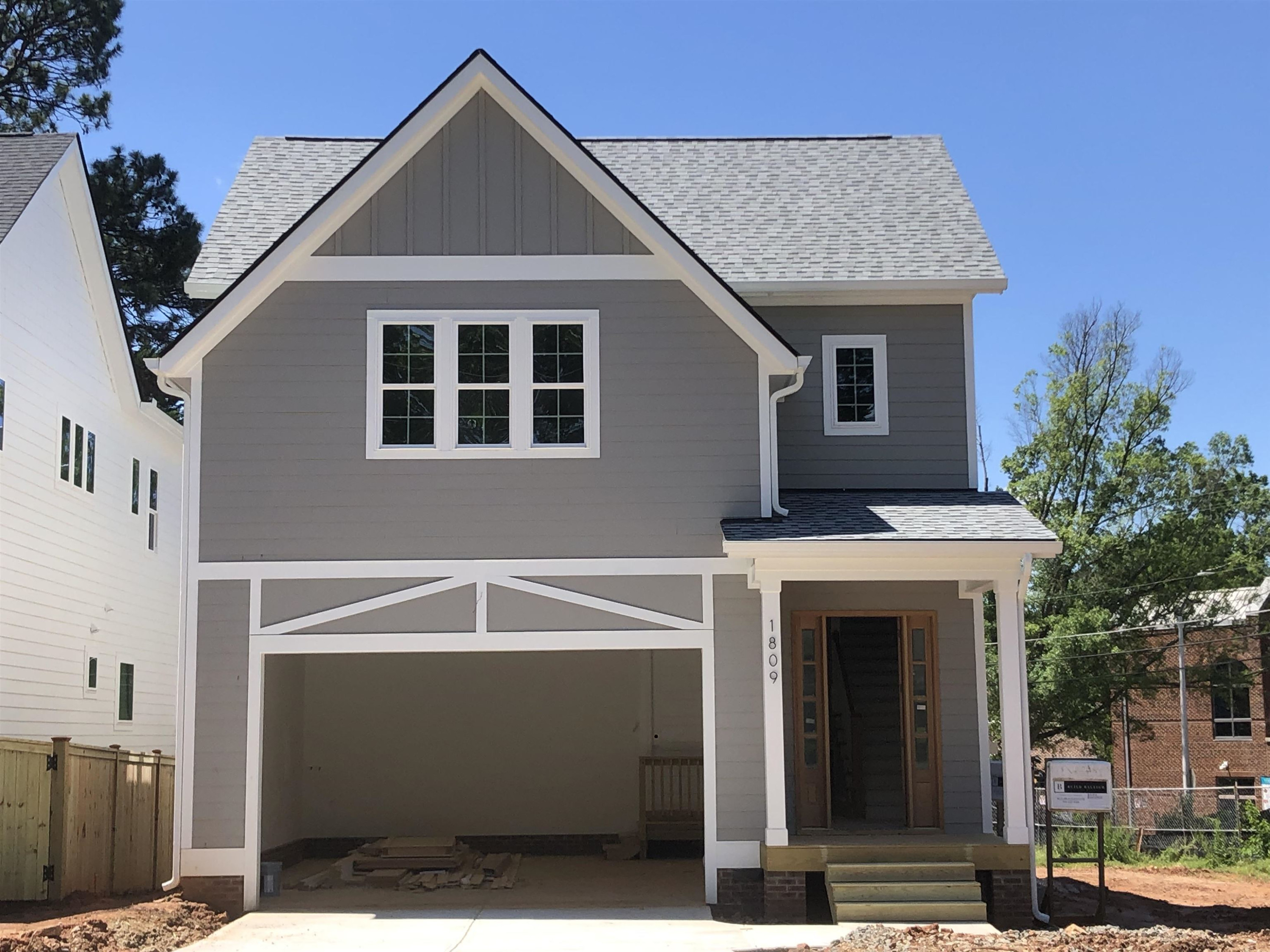 a front view of a house with garage