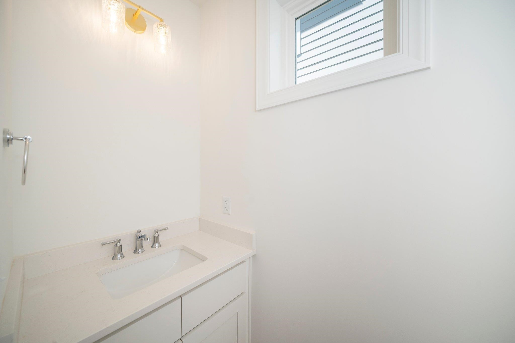 1809 Fairview Road Raleigh, NC 27608 - Photo 12 of 37 a bathroom with a sink and a window