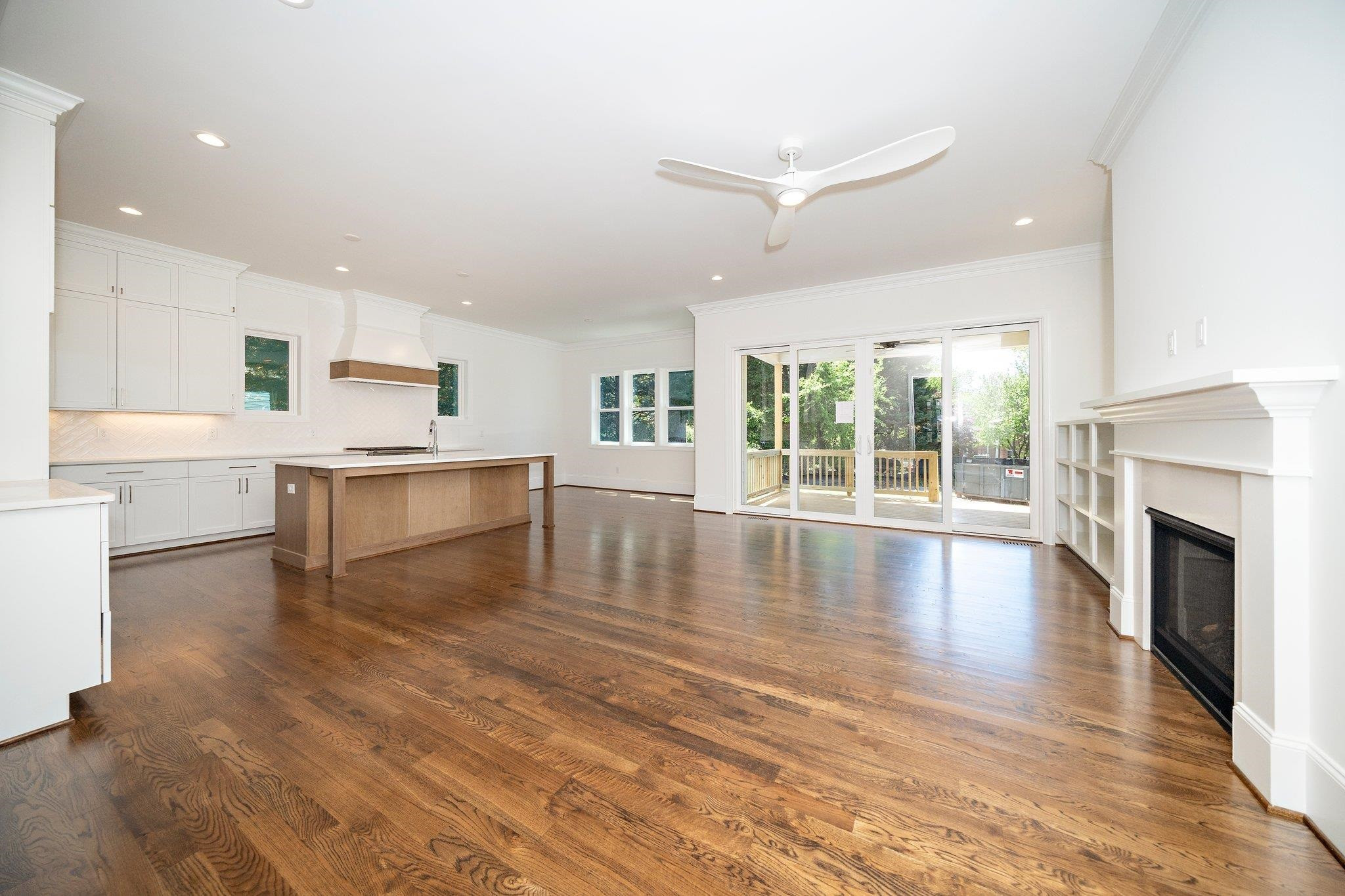 1809 Fairview Road Raleigh, NC 27608 - Photo 14 of 37 a view of a kitchen with a stove cabinets and wooden floor