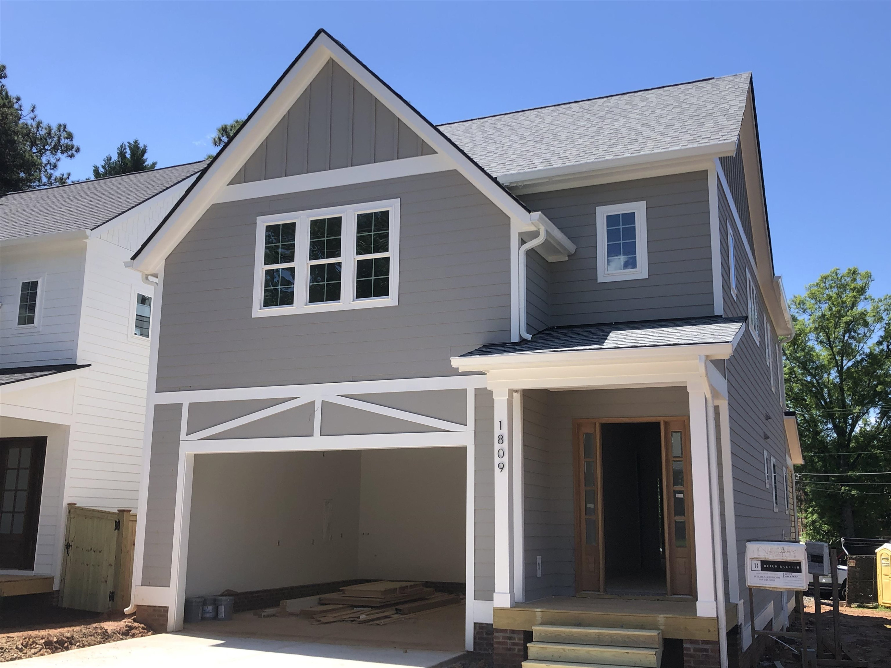 1809 Fairview Road Raleigh, NC 27608 - Photo 2 of 37 a front view of a house with a garage