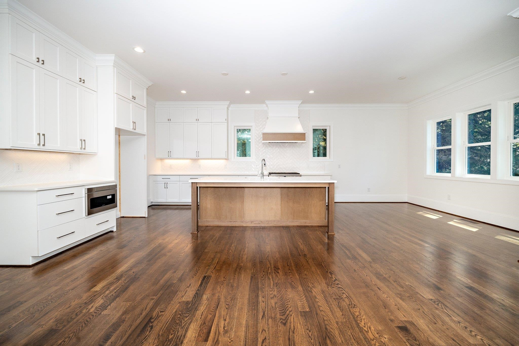 1809 Fairview Road Raleigh, NC 27608 - Photo 22 of 37 a view of kitchen with wooden floor and electronic appliances