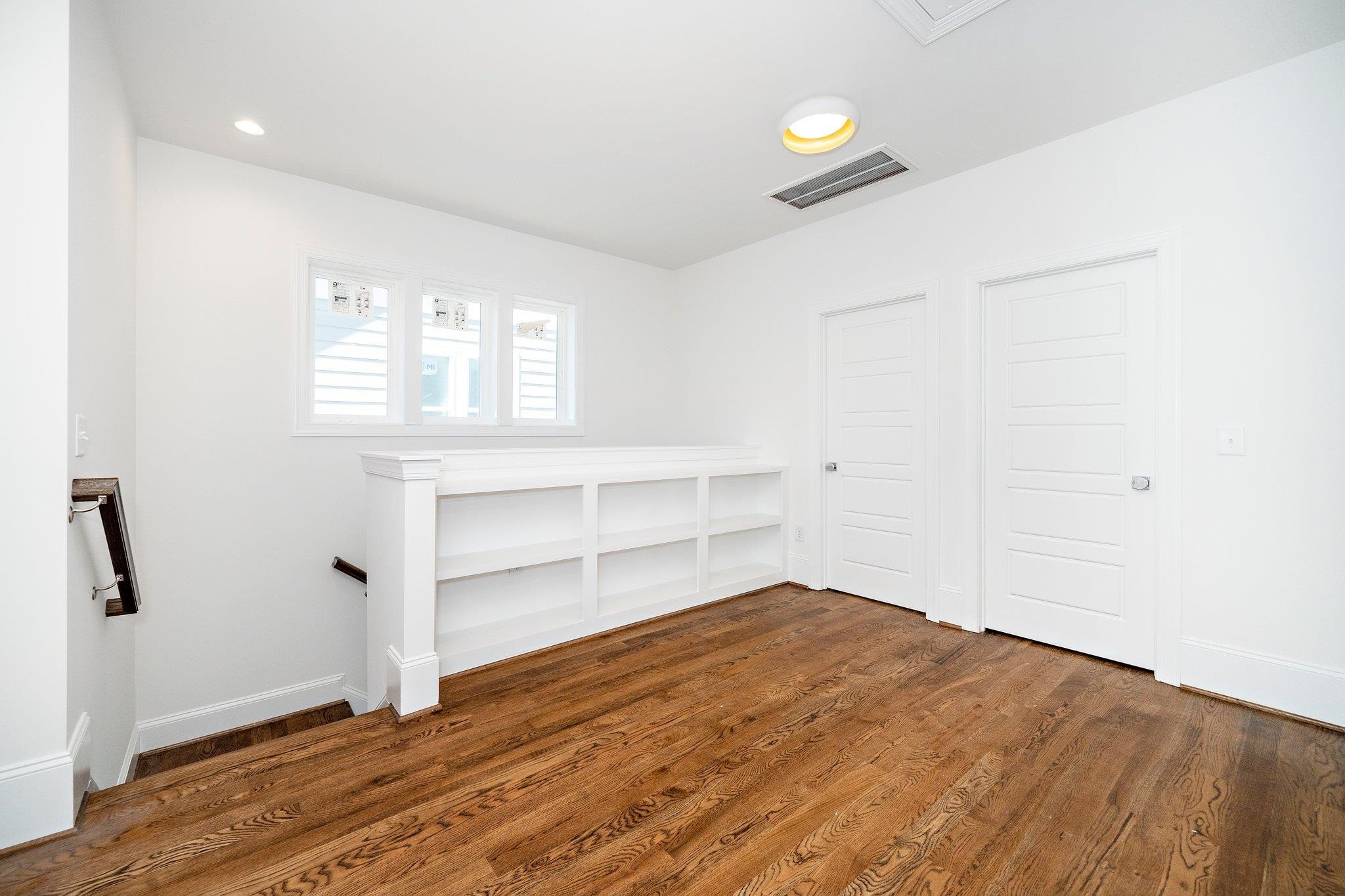 1809 Fairview Road Raleigh, NC 27608 - Photo 29 of 37 a view of empty room with wooden floor