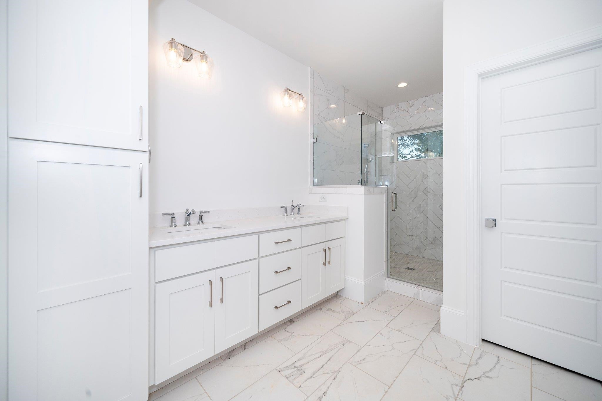 1809 Fairview Road Raleigh, NC 27608 - Photo 36 of 37 a spacious bathroom with a shower sink and mirror