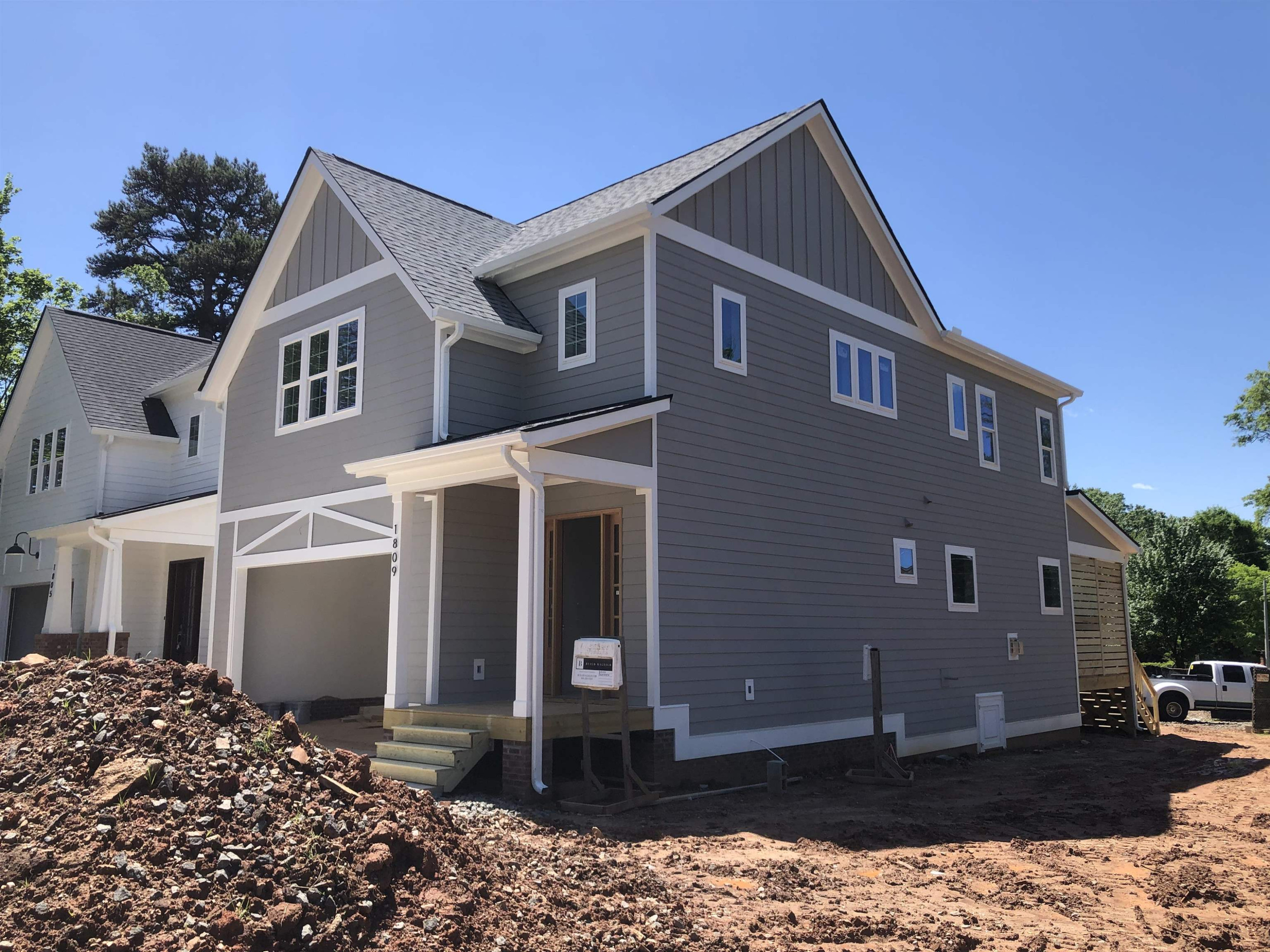 1809 Fairview Road Raleigh, NC 27608 - Photo 4 of 37 a front view of a house with a yard