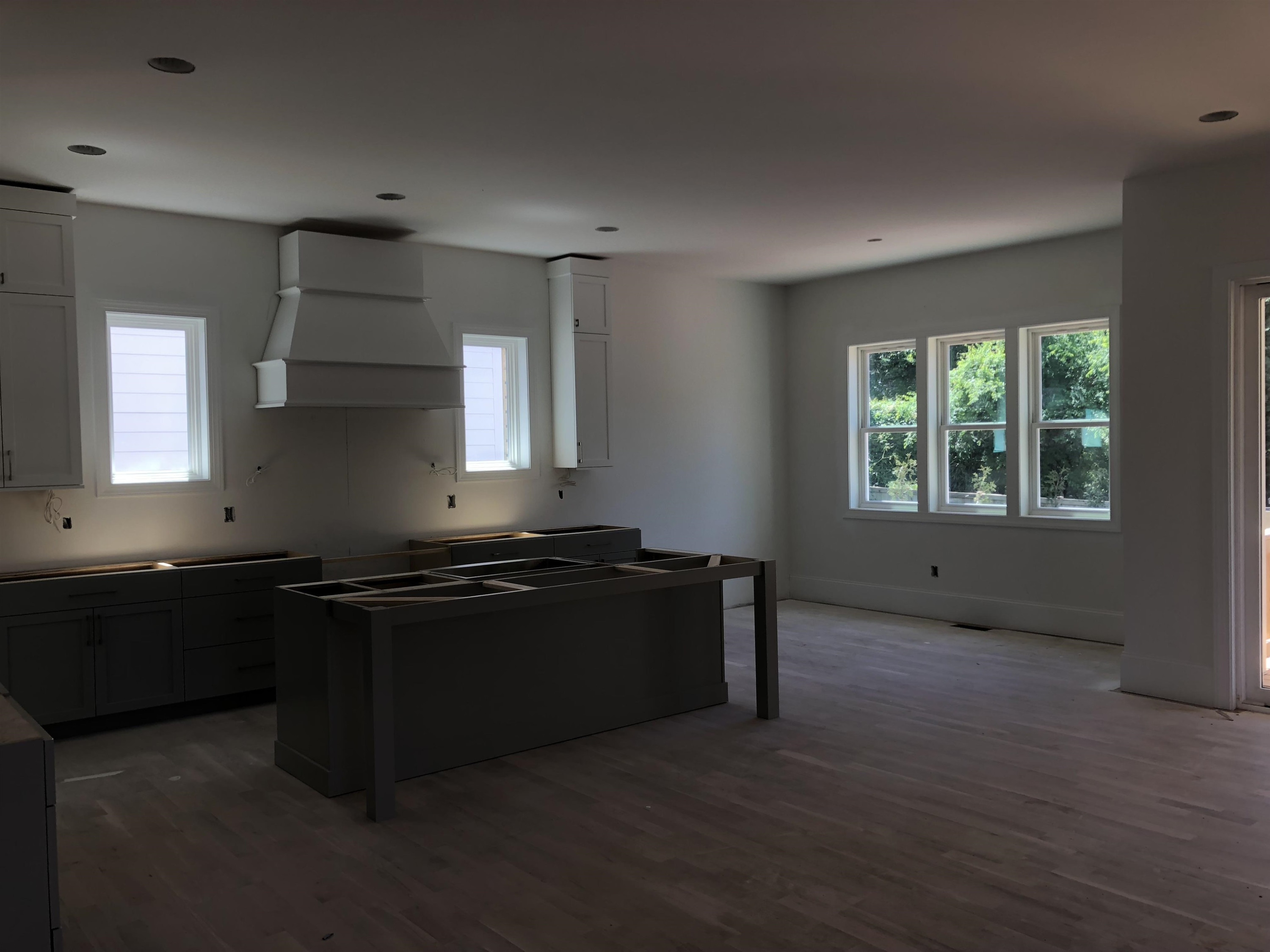 1809 Fairview Road Raleigh, NC 27608 - Photo 6 of 37 an empty room with wooden floor and windows