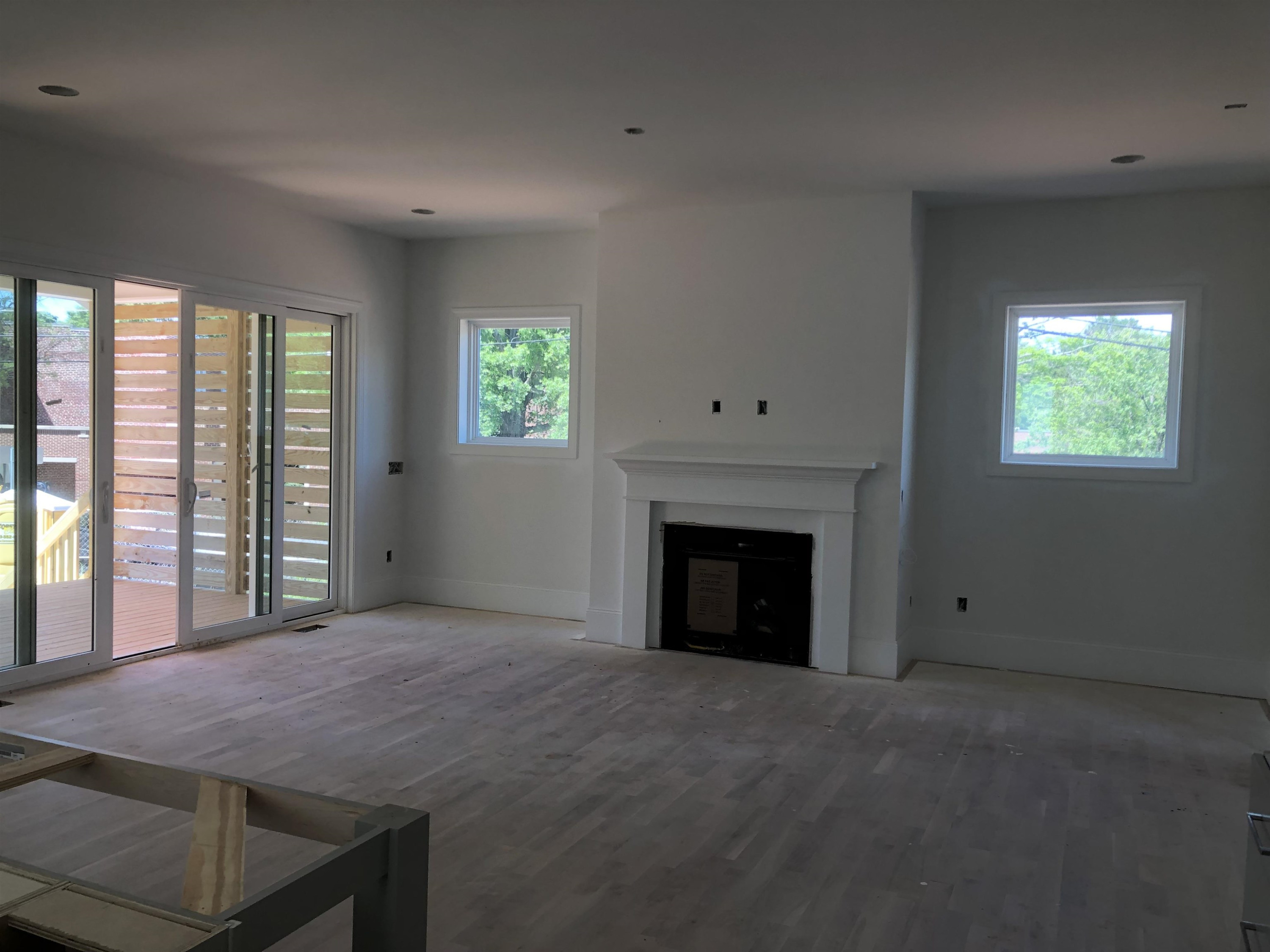 1809 Fairview Road Raleigh, NC 27608 - Photo 7 of 37 a room with a fireplace and a window