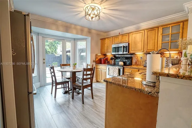 a view of a dining room with furniture window and outside view