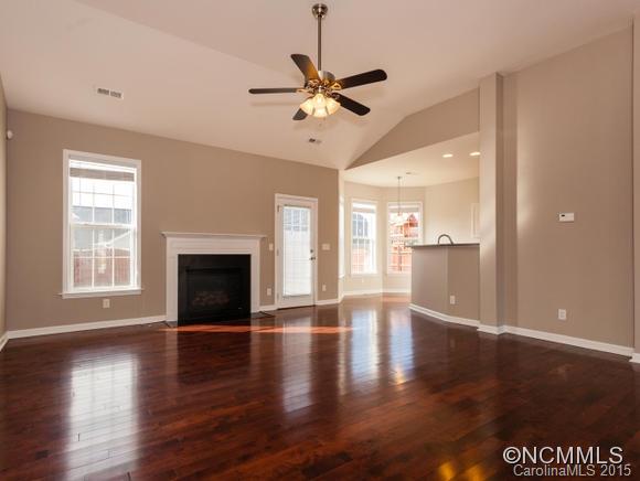 127 Pamlico Road Fletcher, NC 28732 - Photo 2 of 22 a view of empty room with wooden floor and fan