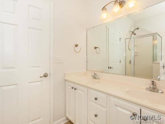 127 Pamlico Road Fletcher, NC 28732 - Photo 12 of 22 a bathroom with a sink and a mirror