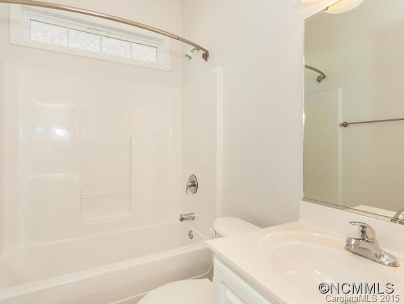 127 Pamlico Road Fletcher, NC 28732 - Photo 17 of 22 a bathroom with a bathtub and a shower