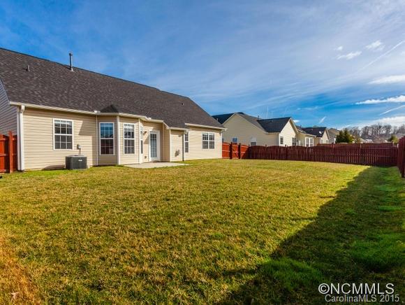 127 Pamlico Road Fletcher, NC 28732 - Photo 20 of 22 a front view of a house with a garden