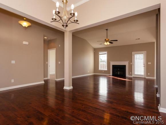 127 Pamlico Road Fletcher, NC 28732 - Photo 7 of 22 a view of an empty room with wooden floor and a window
