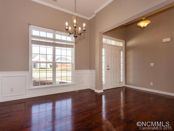 127 Pamlico Road Fletcher, NC 28732 - Photo 8 of 22 a view of an empty room with wooden floor and a window