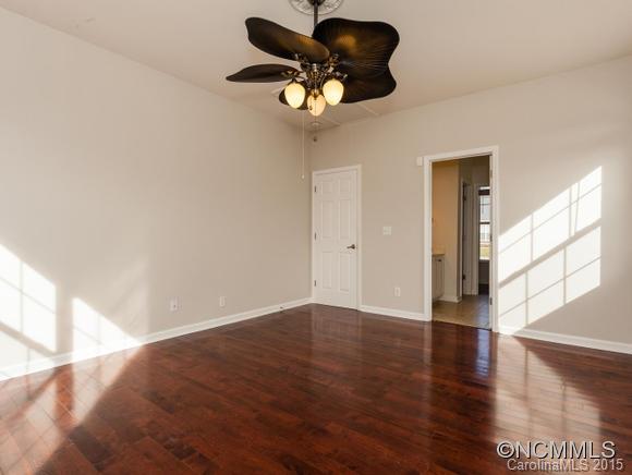 127 Pamlico Road Fletcher, NC 28732 - Photo 10 of 22 a view of an empty room with wooden floor and a window