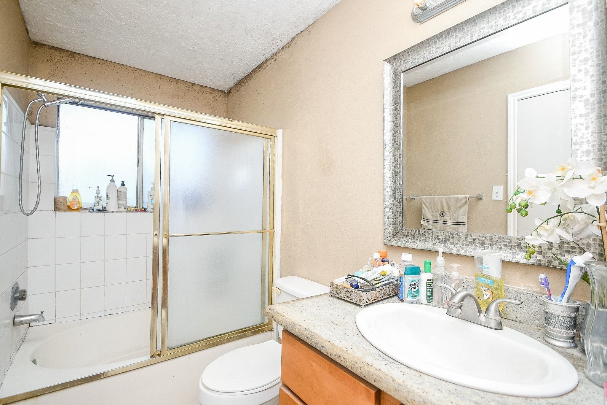 11004 Rustling Winds Drive Houston, TX 77064 - Photo 12 of 20 a bathroom with a sink toilet and shower