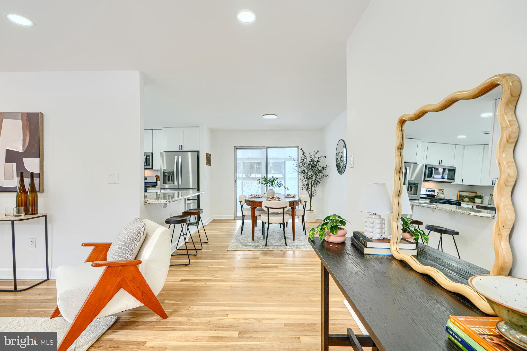 6112 Chesworth Road Baltimore, MD 21228 - Photo 13 of 47 a view of a living room and workspace