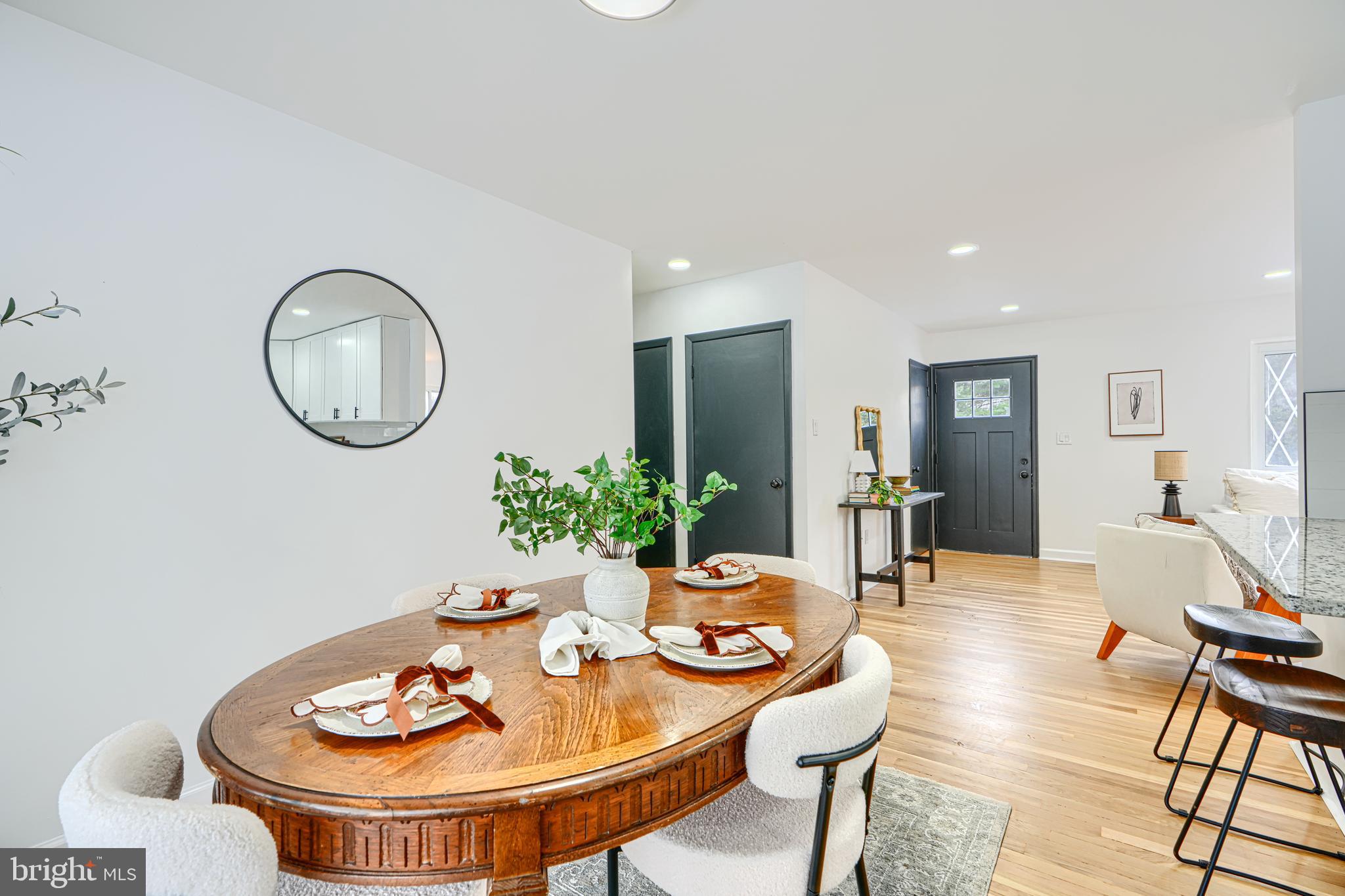 6112 Chesworth Road Baltimore, MD 21228 - Photo 16 of 47 a dining room with furniture and wooden floor