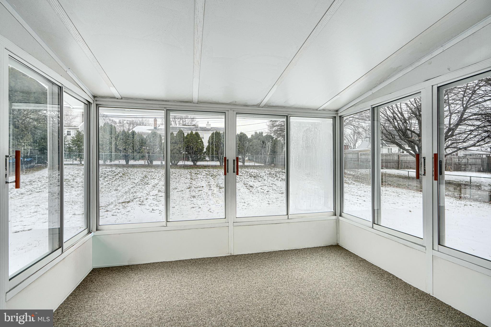 6112 Chesworth Road Baltimore, MD 21228 - Photo 24 of 47 a view of an empty room with a large window