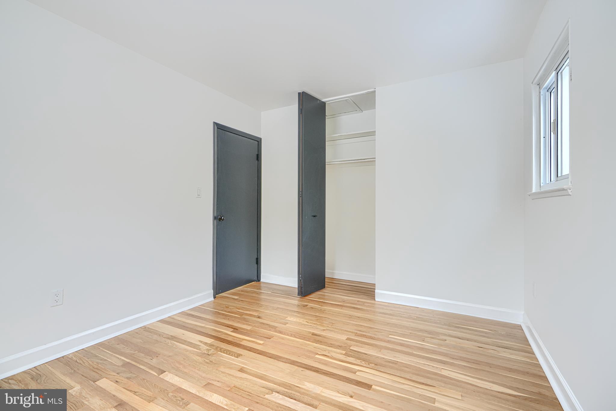 6112 Chesworth Road Baltimore, MD 21228 - Photo 27 of 47 a view of empty room with wooden floor