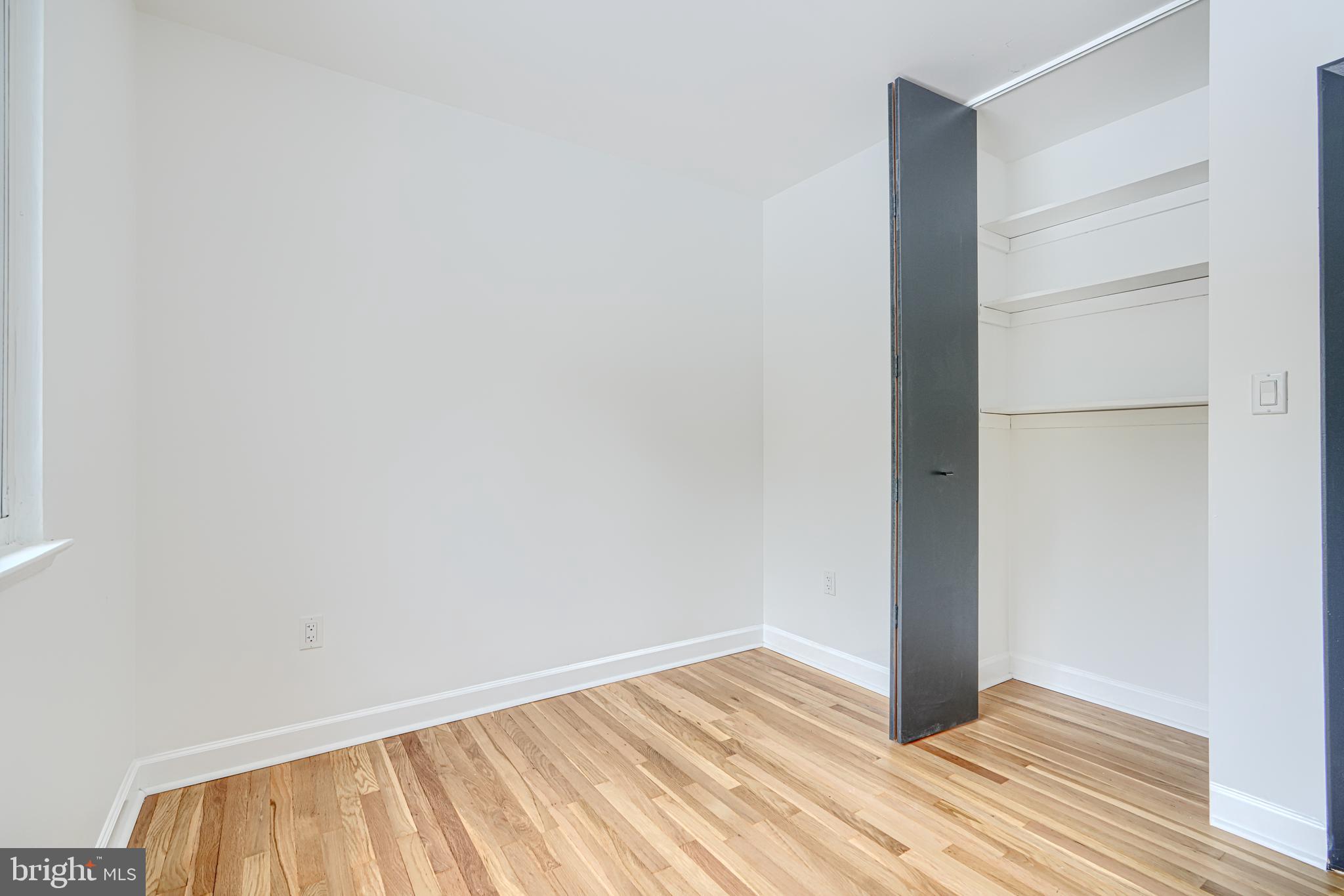 6112 Chesworth Road Baltimore, MD 21228 - Photo 29 of 47 a view of an empty room with wooden floor