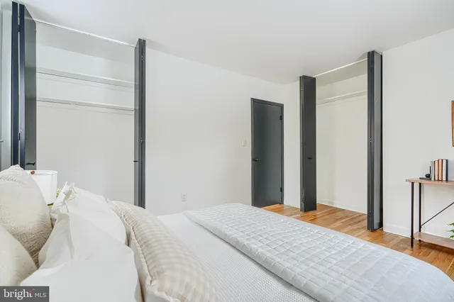 a bedroom with a bed and a closet