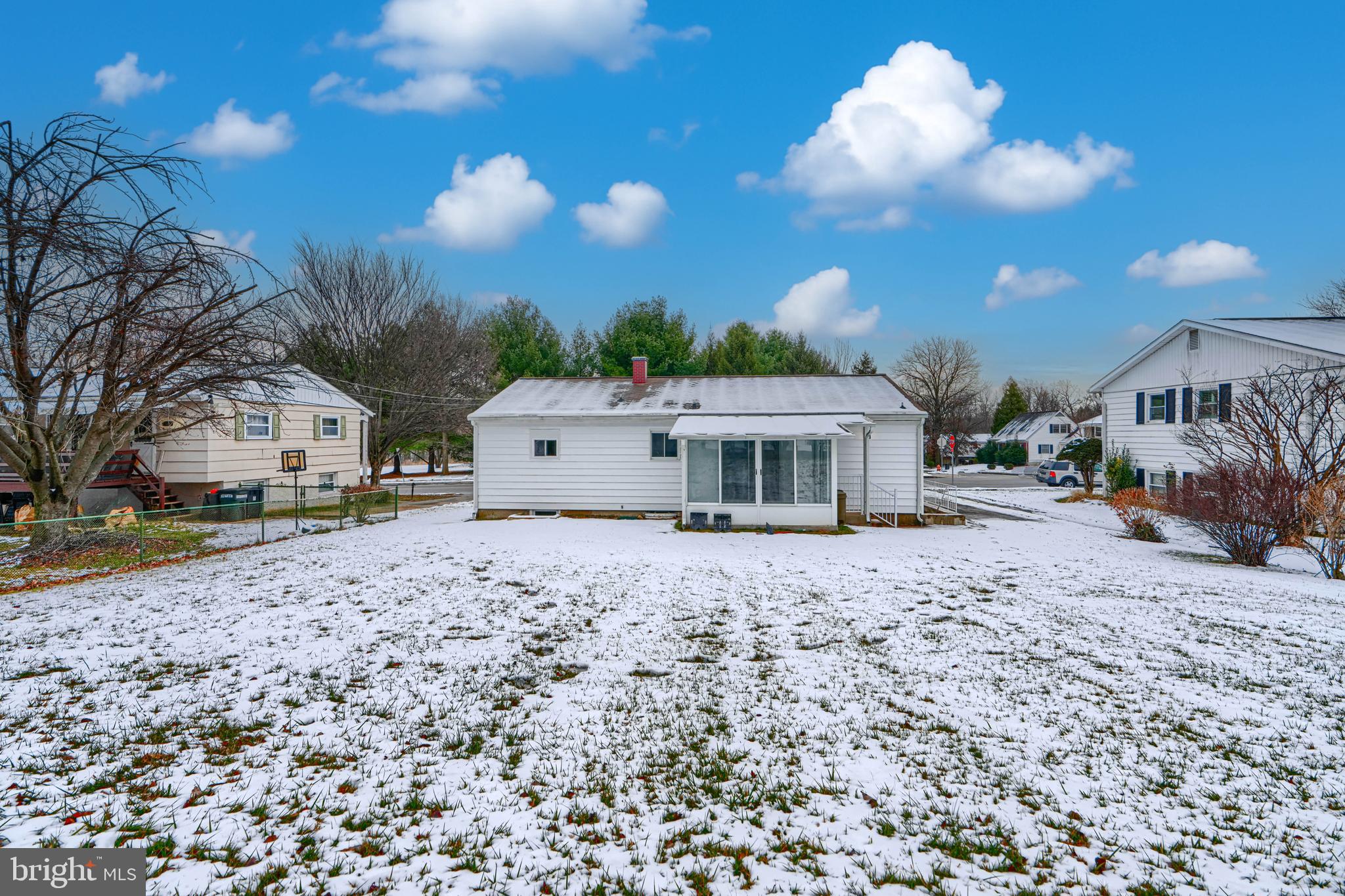 6112 Chesworth Road Baltimore, MD 21228 - Photo 5 of 47 a view of a house with a yard and sitting area