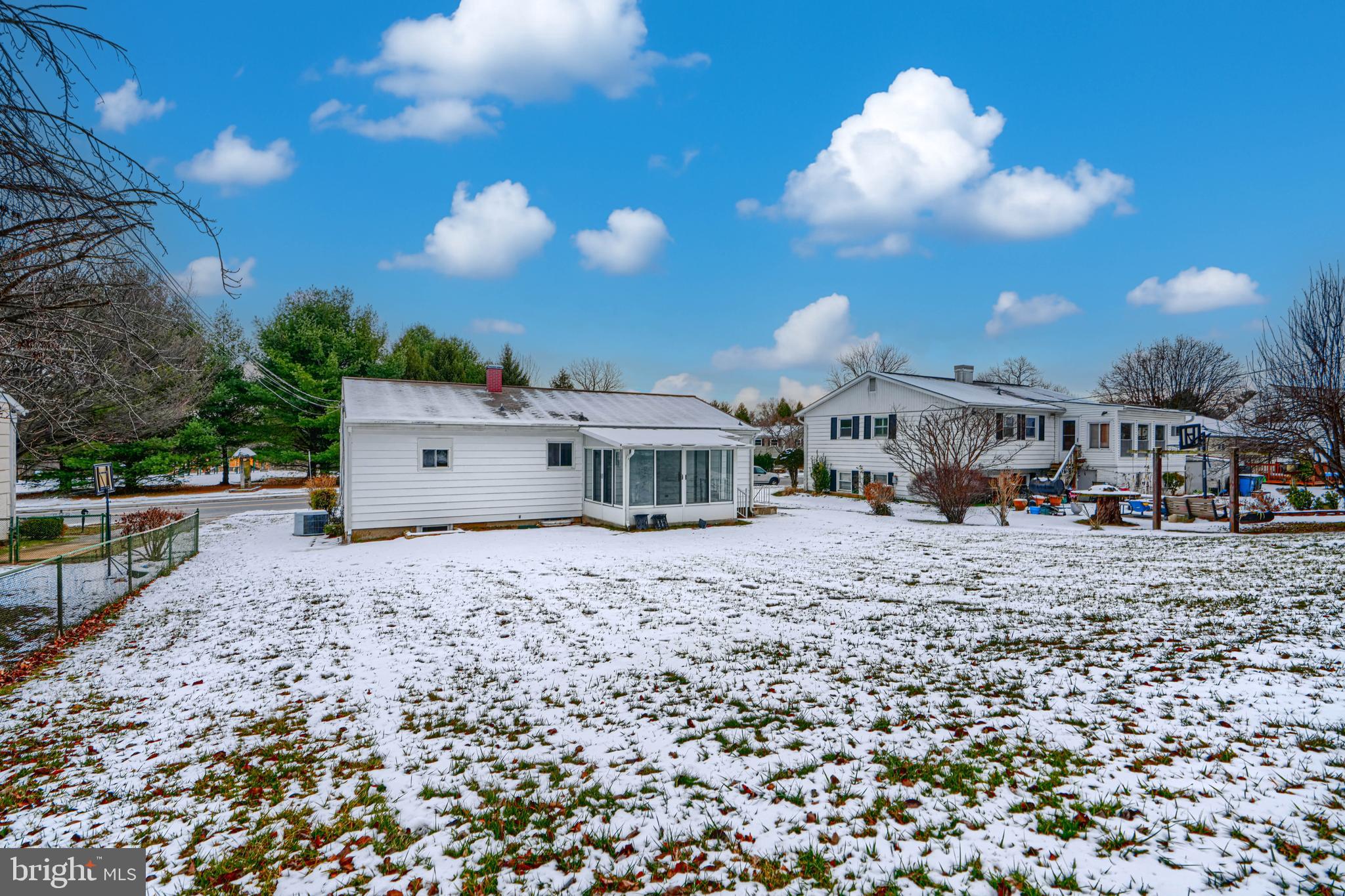 6112 Chesworth Road Baltimore, MD 21228 - Photo 6 of 47 a view of a house with a yard and sitting area