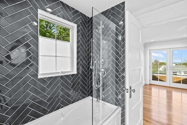 a kitchen with white cabinets and sink