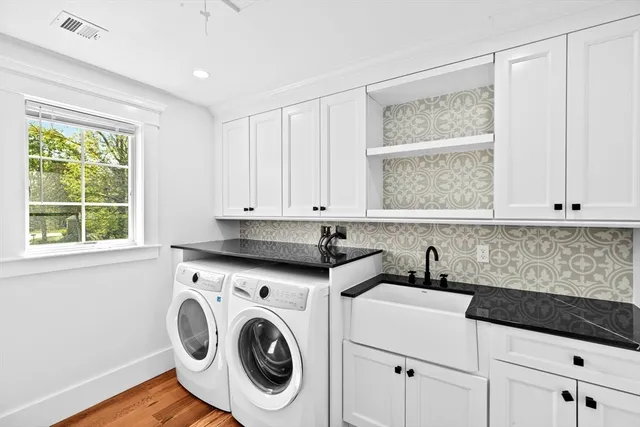 a bedroom with a bed couch and a window