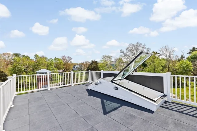 a view of a balcony with wooden floor
