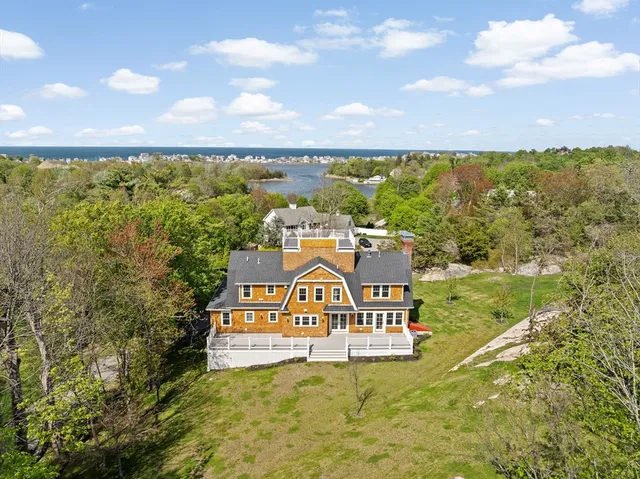a view of a lake with houses in the back