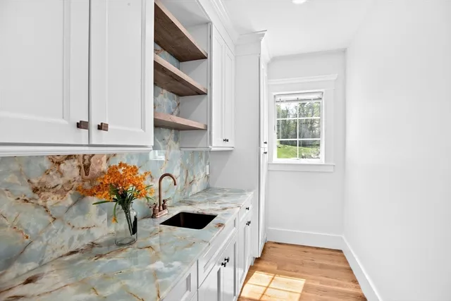 a kitchen with a sink and cabinets
