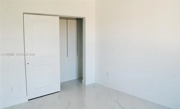 a view of a bathroom with an empty room