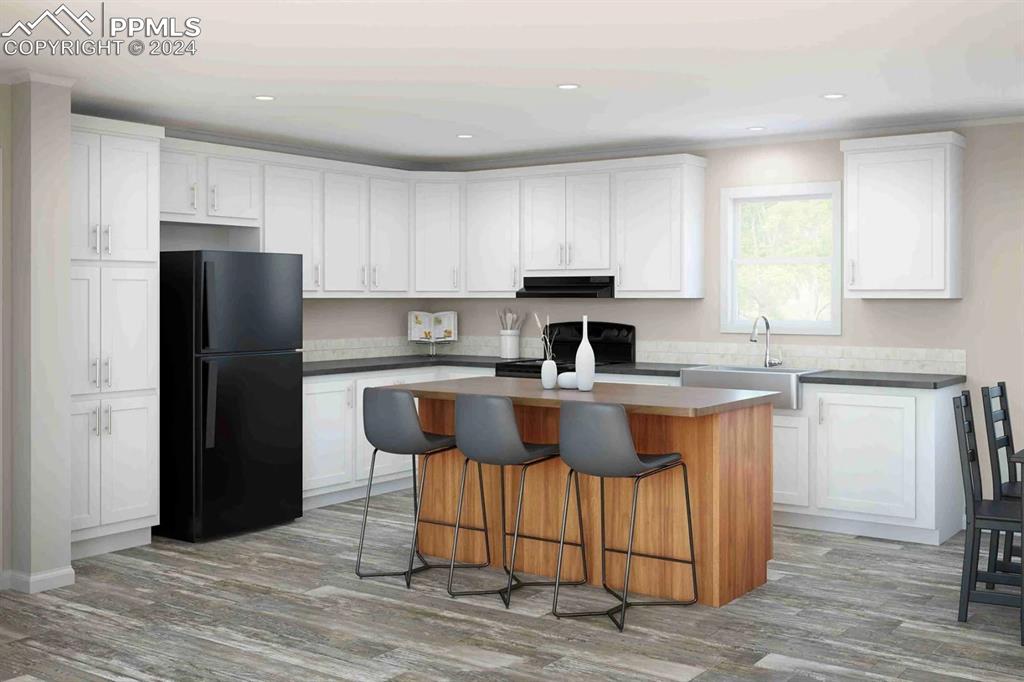 35330 Vorenberg Road Yoder, CO 80864 - Photo 3 of 4 a kitchen with stainless steel appliances granite countertop a refrigerator stove a sink and a microwave