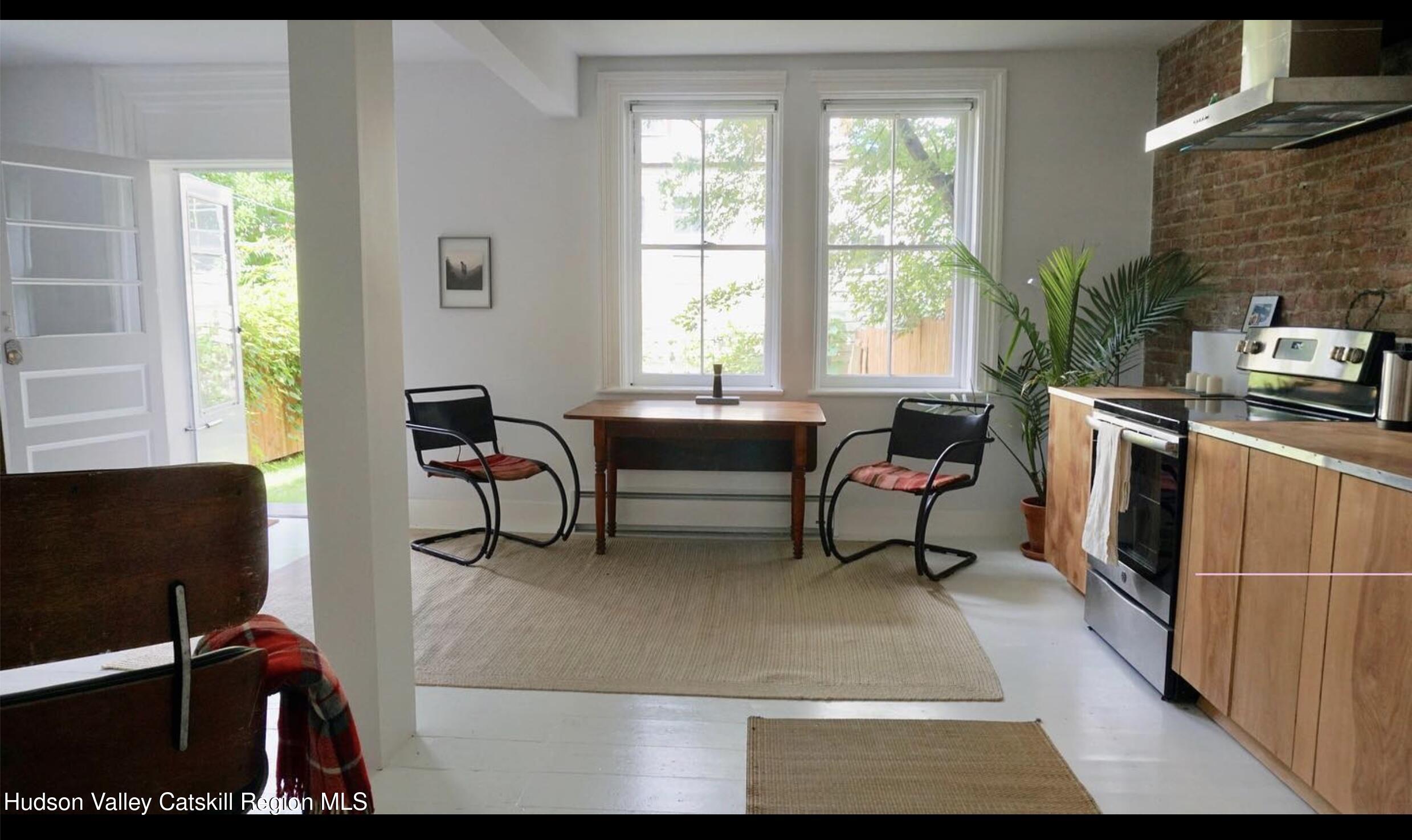 524 State Street Hudson, NY 12534 - Photo 3 of 8 a living room with furniture rug and a window