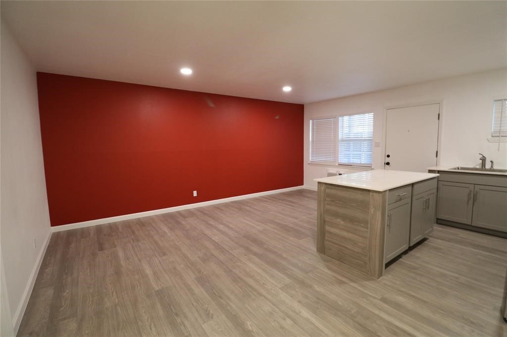 1722 Colquitt Street, Unit 4 Houston, TX 77098 - Photo 1 of 7 a hall with a sink