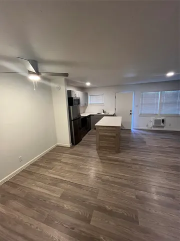 a view of kitchen with wooden floor