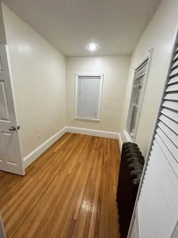 a view of a room with wooden floor and stairs