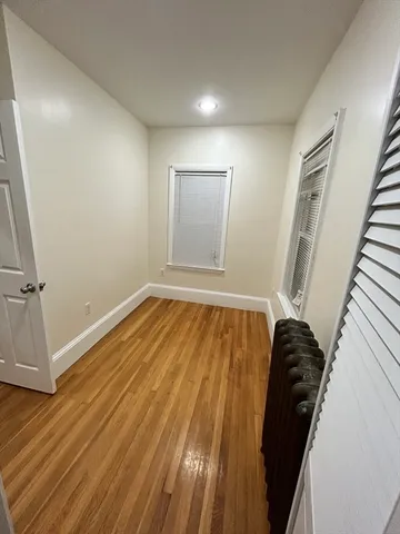 a view of a room with wooden floor and stairs
