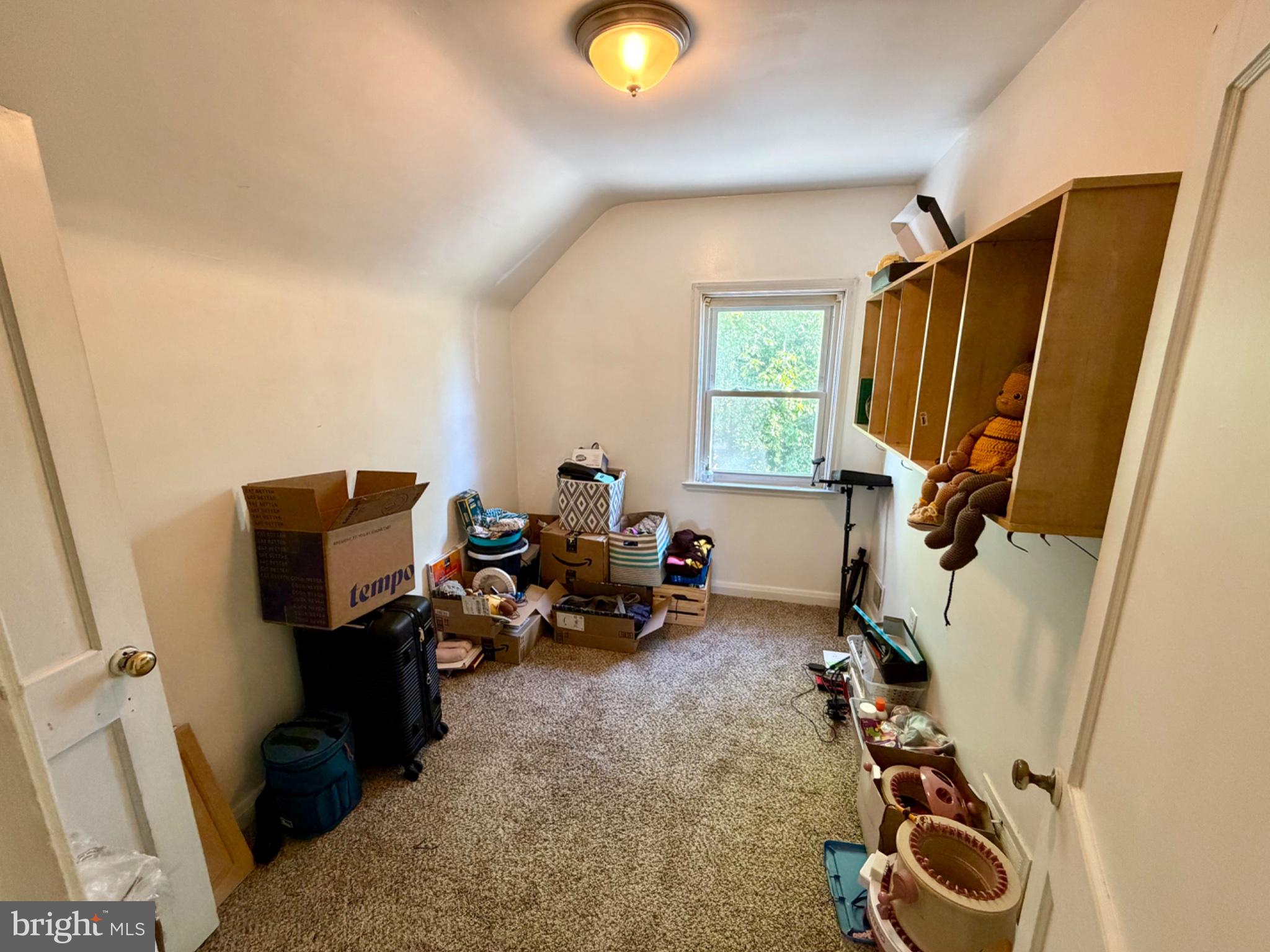 601 Braeside Road Baltimore, MD 21229 - Photo 10 of 19 a room with furniture and a window