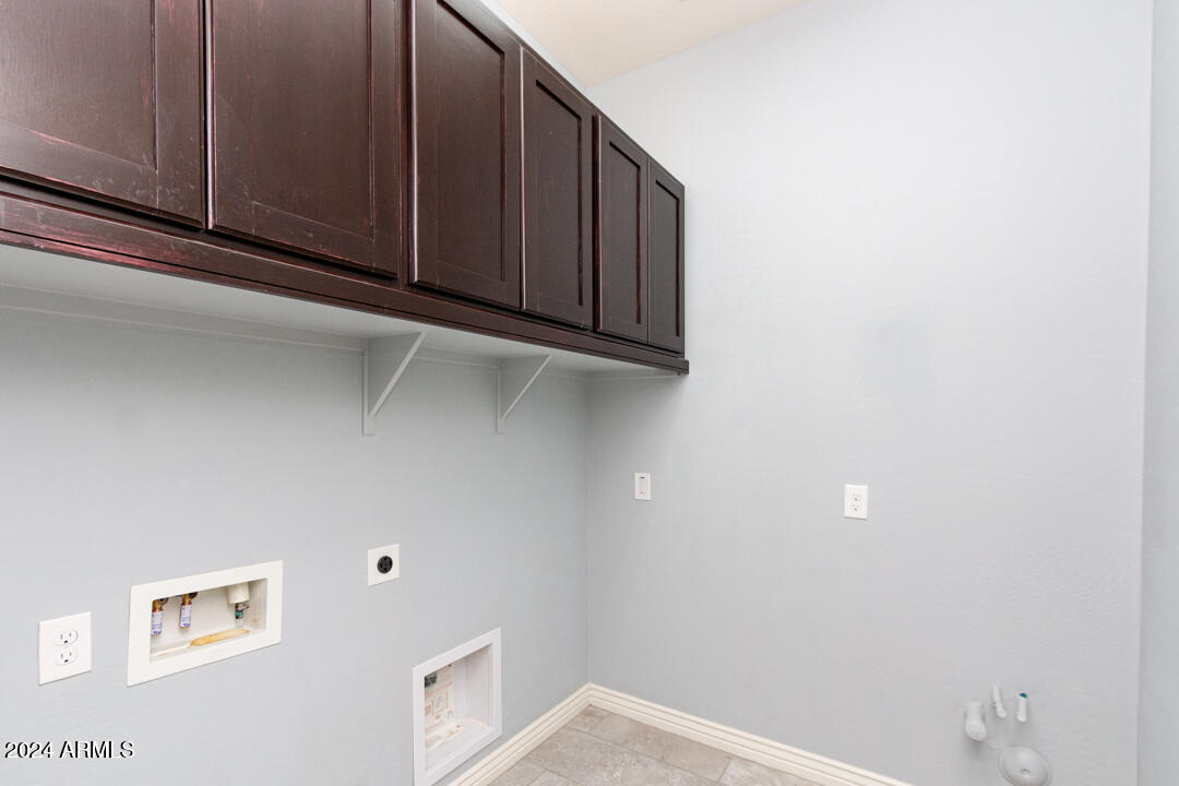 Undisclosed Address Gilbert, AZ 85298 - Photo 11 of 36 a view of storage and utility room with window