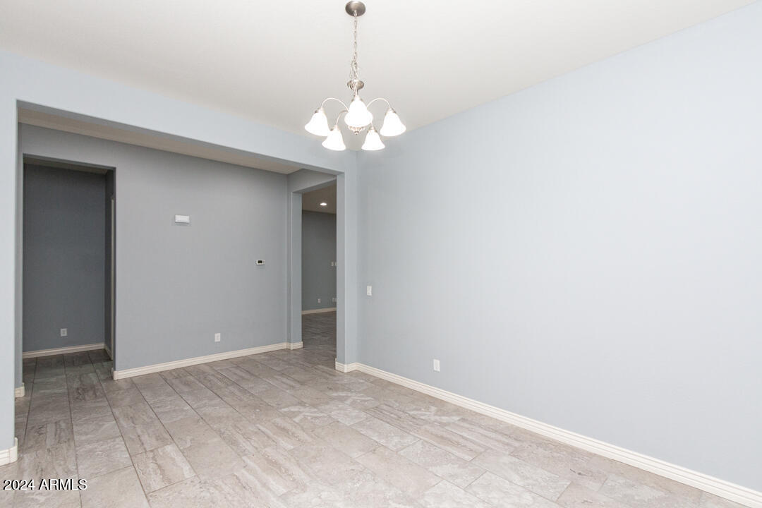 Undisclosed Address Gilbert, AZ 85298 - Photo 14 of 36 a view of a chandelier fan and a chandelier fan