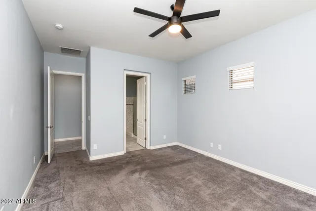 a view of a big room with carpet