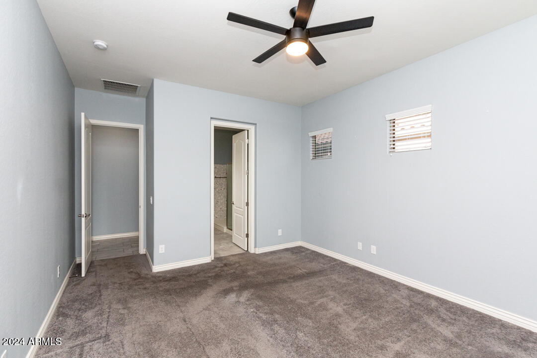 Undisclosed Address Gilbert, AZ 85298 - Photo 16 of 36 a view of a big room with carpet